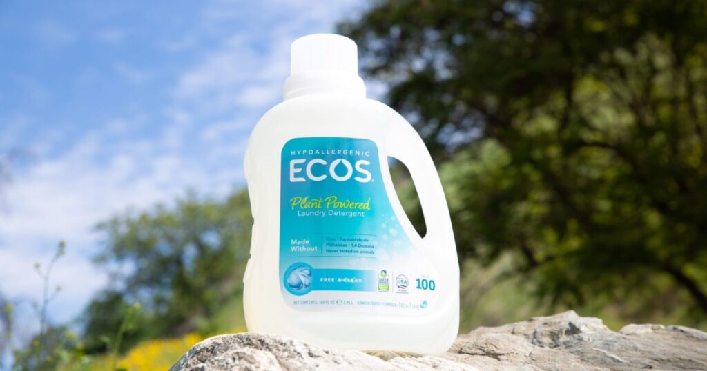 ECOS laundry detergent in front of nature background, greenwashing