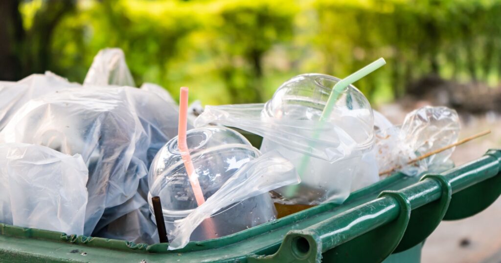plastic cups and bags in a garbage bin, canada plastic ban overturned