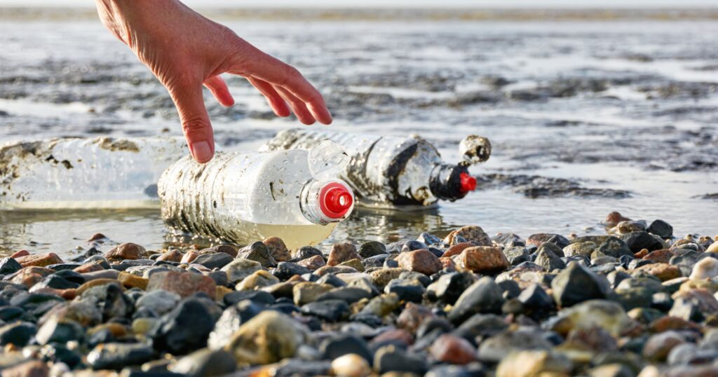 plastic water bottles on beach, canada plastic ban overturned